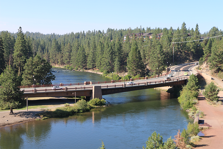 A bridge crosses over a river in Bend.